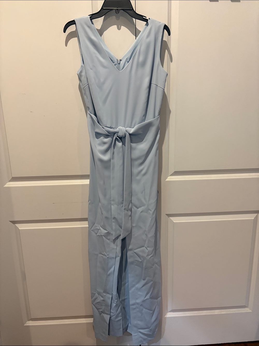 Sleeveless V-Neck Light Blue Jumpsuit with Waist Tie and Flowing Pants